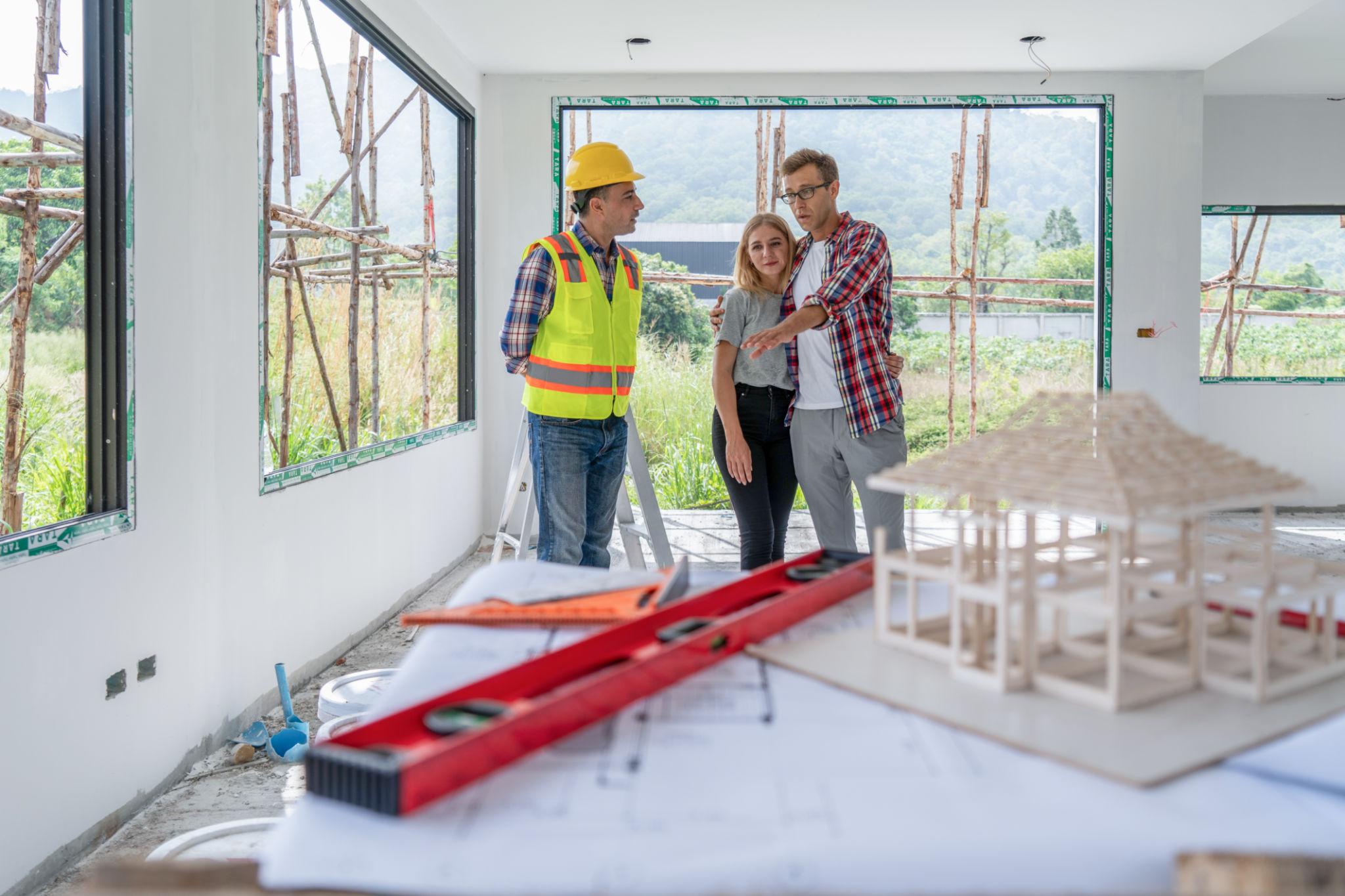 Construction team discussing building plans