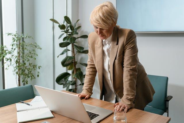 Person working at a laptop in office