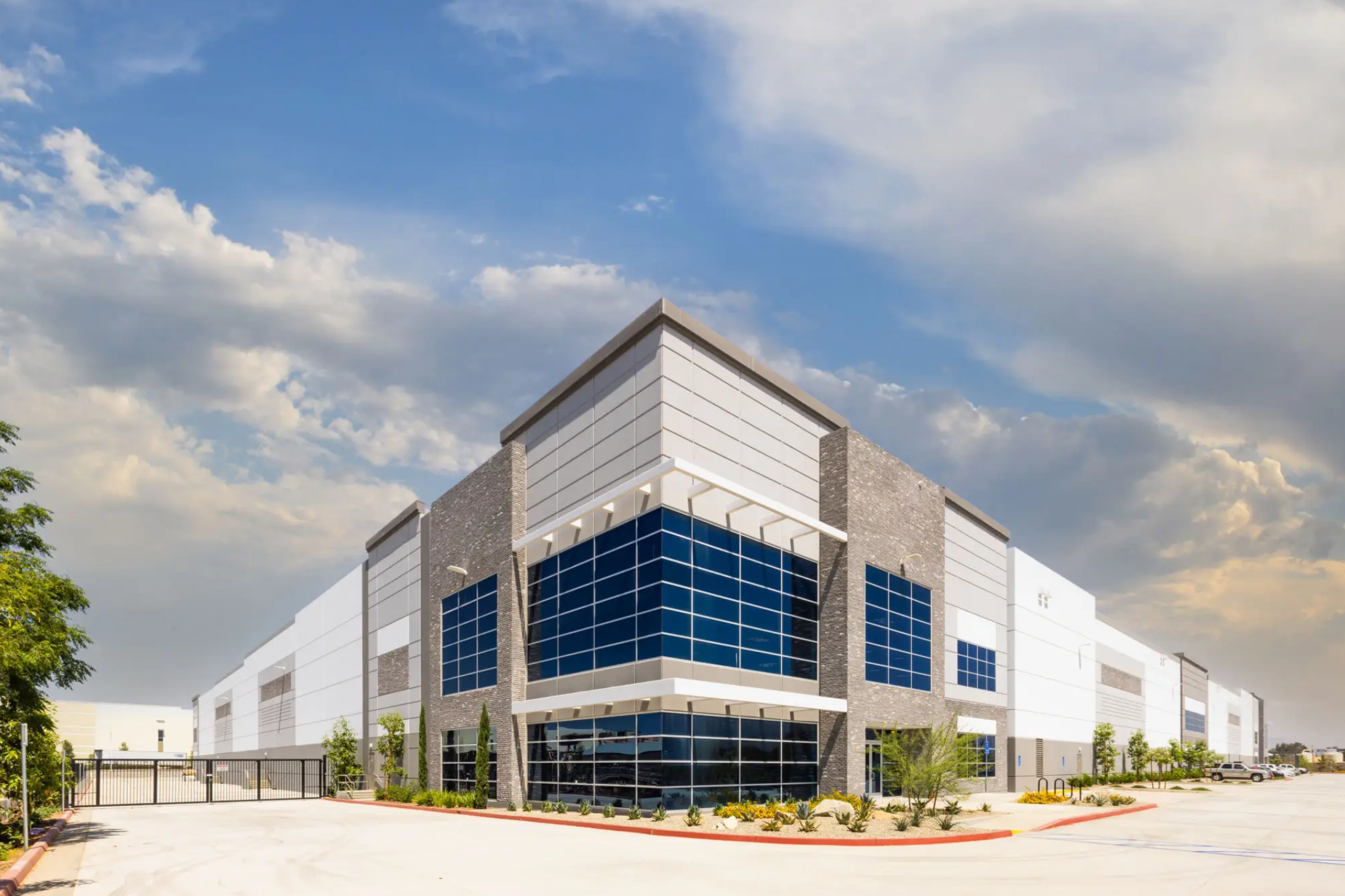 Modern industrial warehouse with glass corner facade