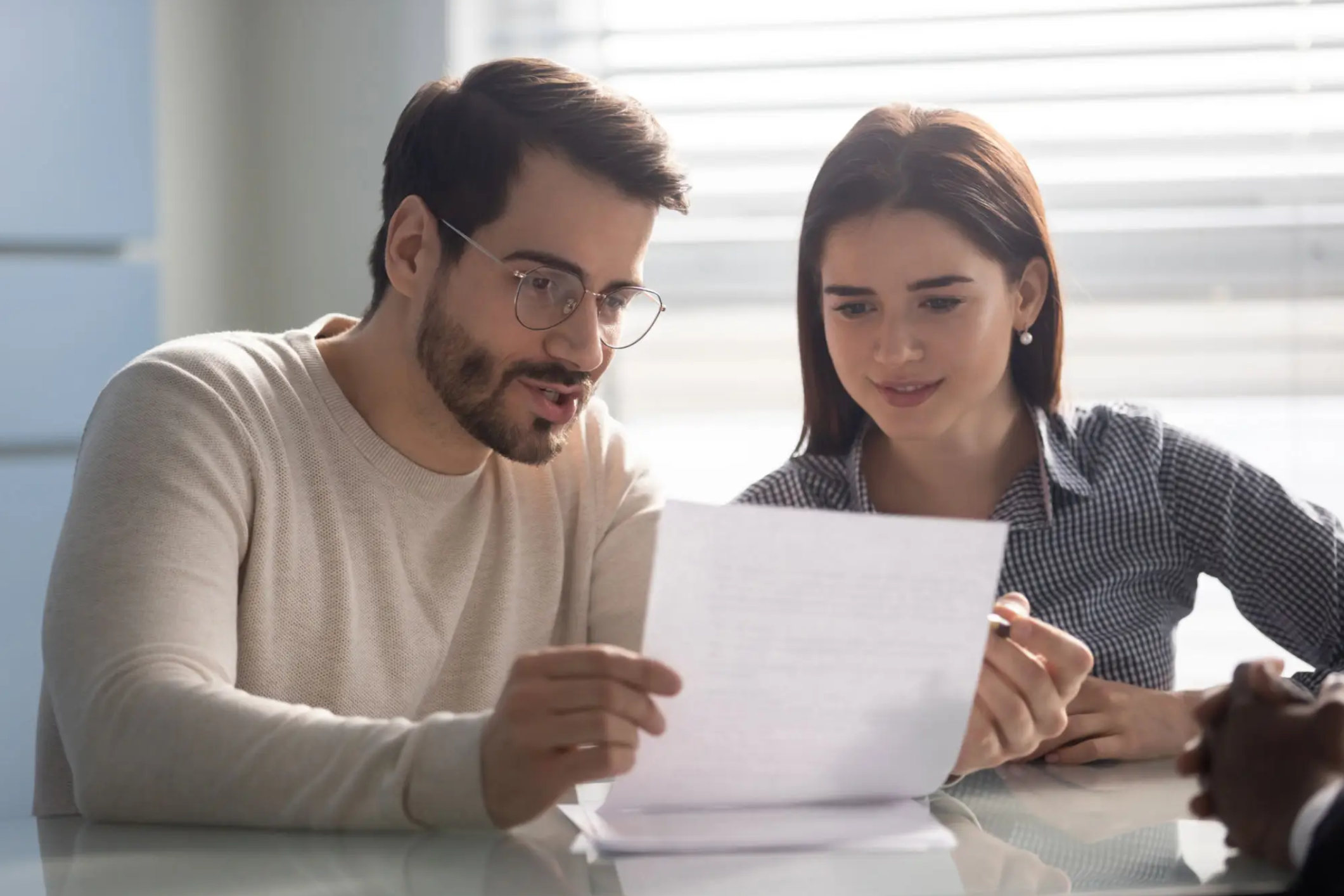 Man and woman reviewing paperwork together